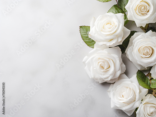 White roses placed on a pastel gray background create a serene composition