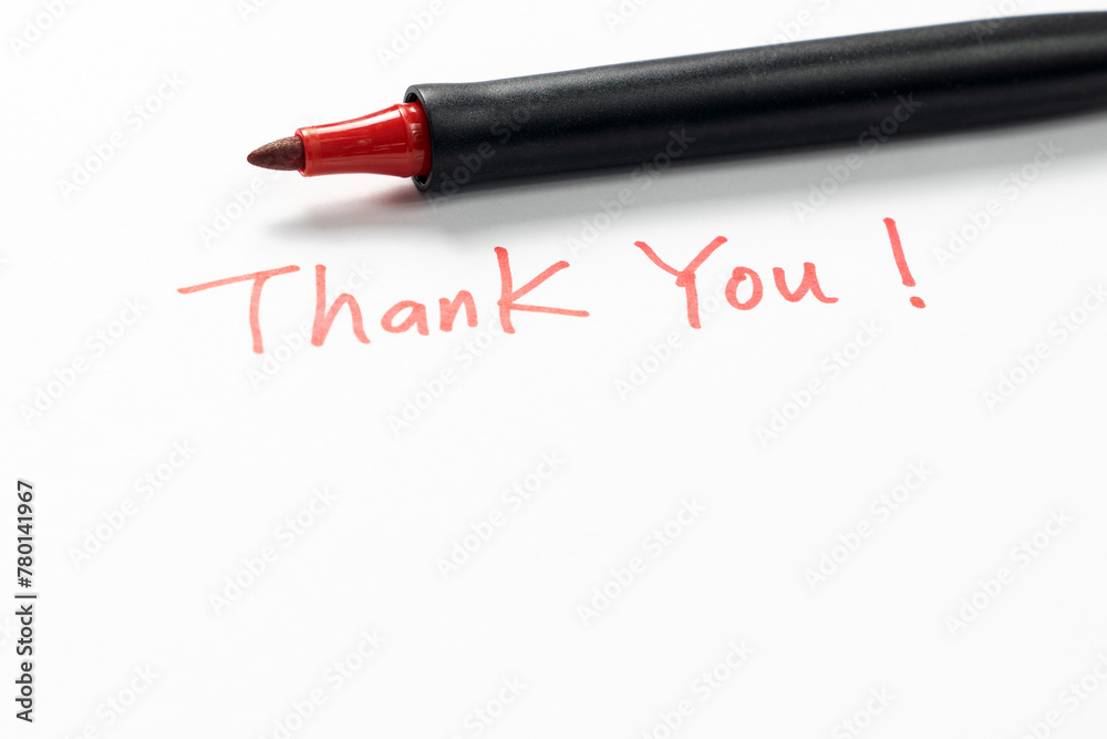 Obraz premium Hand written thank you message with a red pen on white background, gratitude concept.