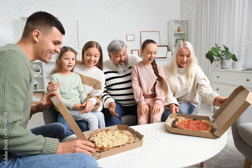 Big family eating pizza at ...