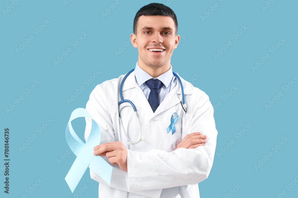Male urologist with blue ribbons on color background. Prostate cancer awareness concept Male urologist with blue ribbons on color background. Prostate cancer awareness concept