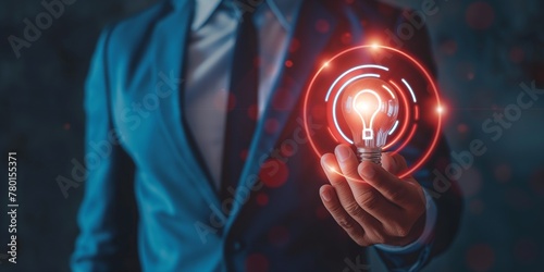 marketing plan and strategies to target customer. A businessman holds a light bulb with target customer icon. Customer behavior analysis and target customer concept,  photo