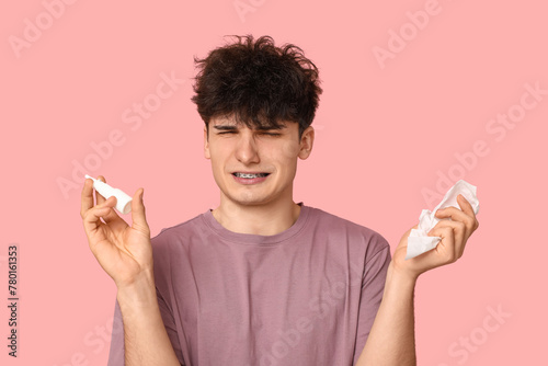 Young man with nasal drops ...