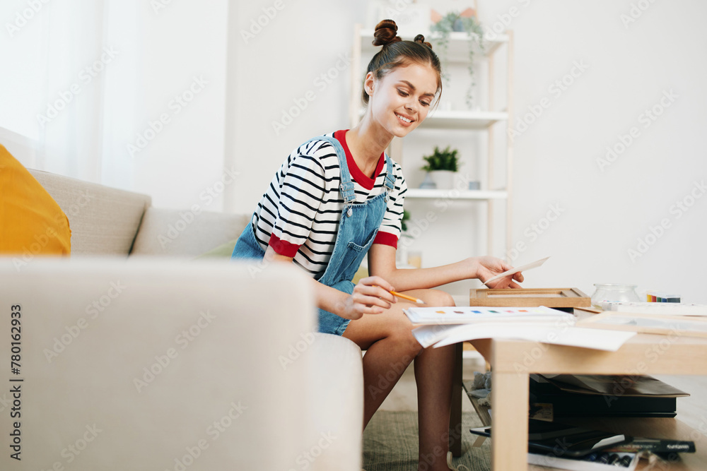 Teenage Girl, Happy and Creative, Painting a Picture in her Modern Home Studio Teenage Girl, Happy and Creative, Painting a Picture in her Modern Home Studio