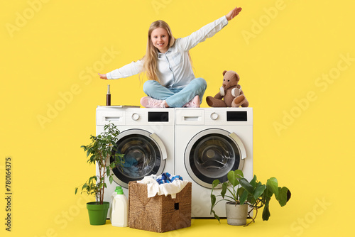 Girl with teddy bear sittin...