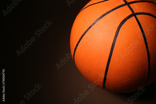 Ball for playing basketball game on dark background, closeup © Pixel-Shot