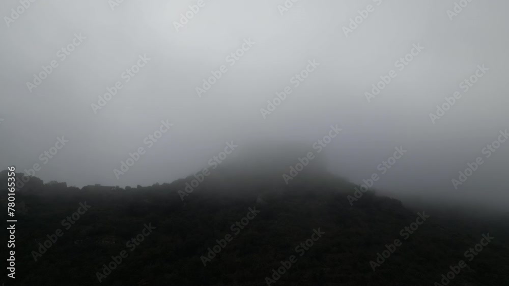 Aerial view house on top of the Mountain, surrounded by cloud, Camarasa, Catalonia. Aerial view house on top of the Mountain, surrounded by cloud, Camarasa, Catalonia.