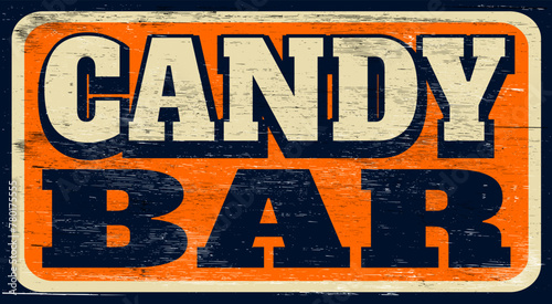 Aged vintage candy bar sign on wood