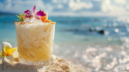 Close-up of a rustic pina colada, fresh fruit crowning the glass, sandy beach and a solitary exotic flower beside
