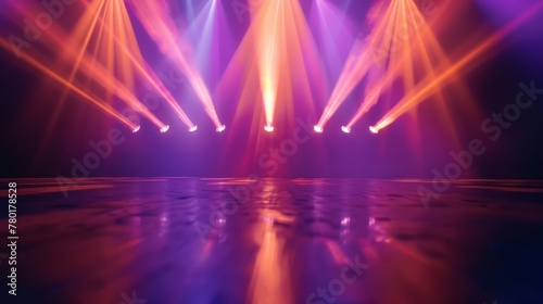 blurred rays of light on disco floor. orange violet blue neon searchlight lights. laser lines and lighting effect.