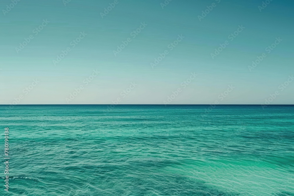 A gradient of ocean colors from deep sea green to clear turquoise
