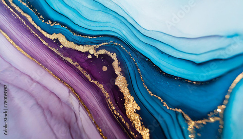 Luxury abstract fluid art painting in alcohol ink technique, mixture of blue and purple paints. Imitation of marble stone cut, glowing golden veins. Tender and dreamy design.