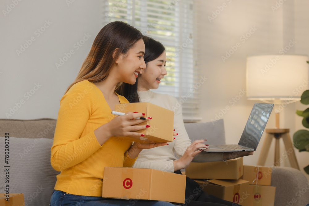 Two business owners are checking customer information on a package before it is delivered to the buyer, Two co-workers are checking that order data matches sales figures. Two business owners are checking customer information on a package before it is delivered to the buyer, Two co-workers are checking that order data matches sales figures.