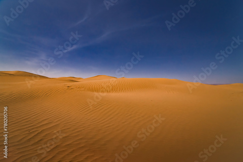 A panoramic sand dune of sahara desert at Mhamid el Ghizlane in Morocco wide shot