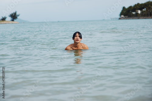 Swimming Man: Joyful Asian Vacation in Tropical Blue Waters