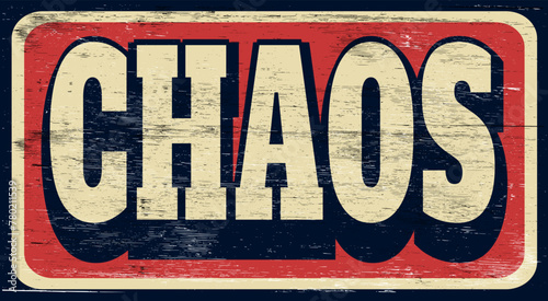 Aged and worn chaos sign on wood