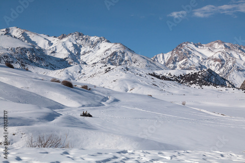 Beautiful winter mountain landscape. Snowmobiling © kvdkz