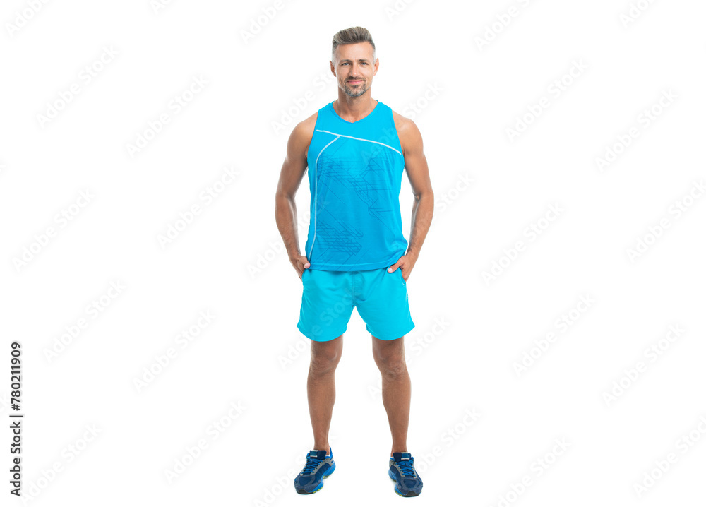 glad athlete wearing sport wear standing alone. The male sport athlete posing on studio. sport athlete with fit body isolated against white. Sport and healthy lifestyle. full length of athlete glad athlete wearing sport wear standing alone. The male sport athlete posing on studio. sport athlete with fit body isolated against white. Sport and healthy lifestyle. full length of athlete