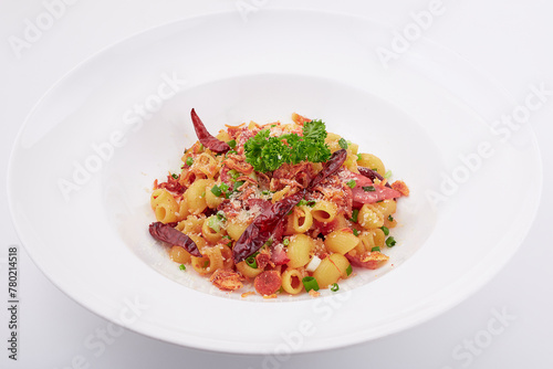 Stir-fried Macaroni dried chili with ham and bacon topped with parsley, dried chilli, sliced spring onion, fried garlic, and cheese.