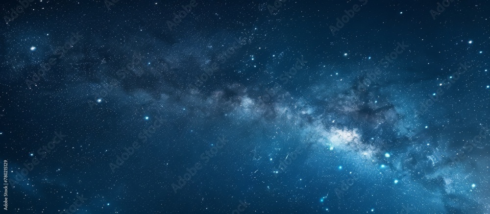 Captivating close-up view of a vast galaxy filled with countless shimmering stars against a serene blue sky backdrop