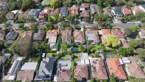 Aerial view flyover of leafy middle class suburb homes