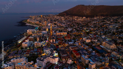 aerial landscape view of area around Sea Point a district in Cape Town, South Africa with Signal Hill Mountain, during sunset 