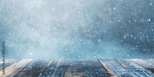 Wooden planks with a backdrop of gently falling snow, conveying a serene and wintry atmosphere.