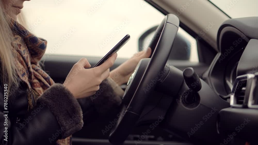 Driver texting while driving . Road safety rules