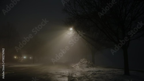 Dark street whit street light at night with heavy fog. Wide shot