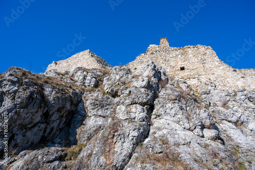 Photography The historic stone walls of Devín Castle on a rocky cliff.