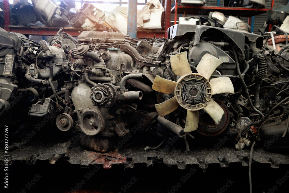 Fototapeta premium Auto parts and secondhand engine components in auto spare parts store. Spare parts of vehicle in warehouse.