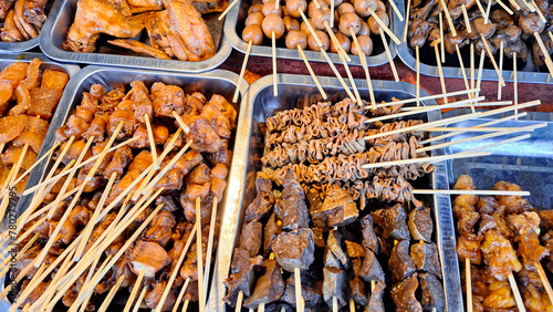 Foto Various types of food and satay menus sold at Angkringan or street food carts in Yogyakarta, Indonesia