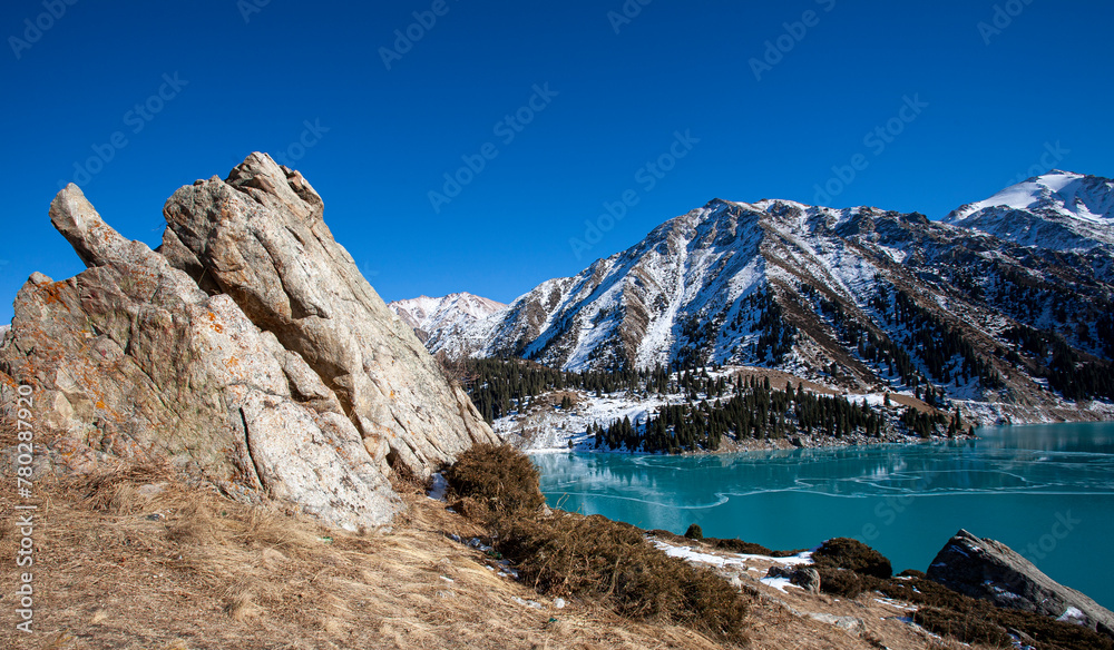 Obraz premium Big Almaty Lake is natural alpine reservoir. It is located in the Trans-Ili Alatau mountains, 15 km south from the center of Almaty in Kazakhstan. The lake is 2511 meters above sea level.