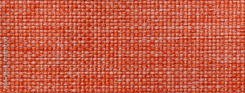 Texture of dark orange background from woven textile material with wicker pattern, macro. Vintage red fabric © nikol85