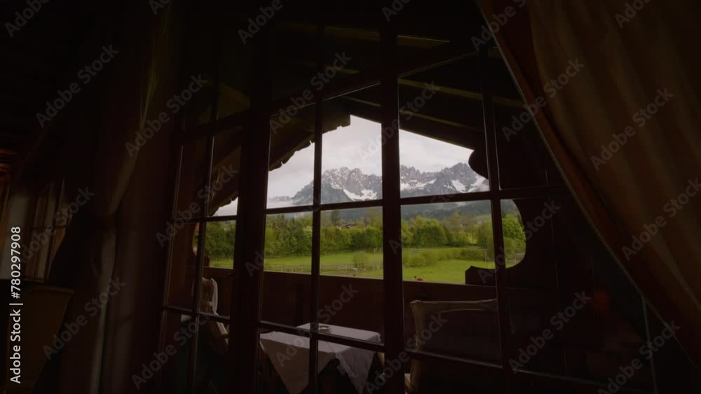 View from ski hotel or resort overlooking mountains and green trees. Cabin or hotel with panoramic view to the outside. Nature and travelling concept. View from ski hotel or resort overlooking mountains and green trees. Cabin or hotel with panoramic view to the outside. Nature and travelling concept.