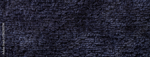 Texture of navy blue background from fleecy textile material, macro. Vintage dark denim fabric cloth