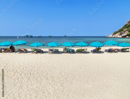     Landscape view tropical beach with turquoise sea with row of  parasols at Koh Nang Yuan paradise island suratthani , Thailand.Destination summer holiday concept.