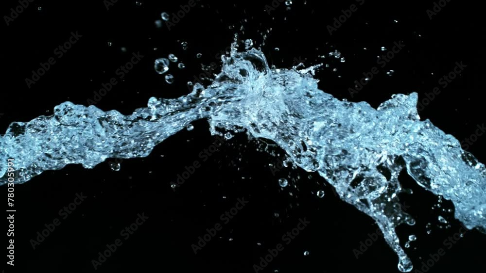Super Slow Motion of Flying Water Splashes, Isolated on Black Background. Filmed on High Speed Cinema Camera, 1000fps. Super Slow Motion of Flying Water Splashes, Isolated on Black Background. Filmed on High Speed Cinema Camera, 1000fps.