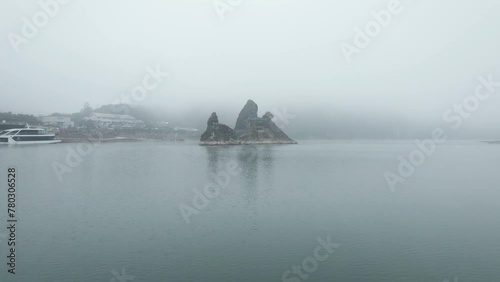 Dodamsambong Peaks Danyang Korea Drone Footage of peaks in river with pagoda and f og photo