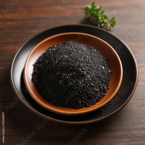 Coarse black salt in a bowl. Hawaiian lava salt. Himalayan black rock salt. Thursday's salt.