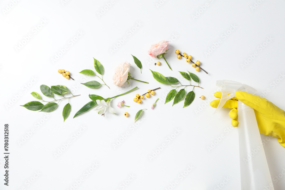 Detergents with fresh flowers on a white background - obrazy, fototapety, plakaty 