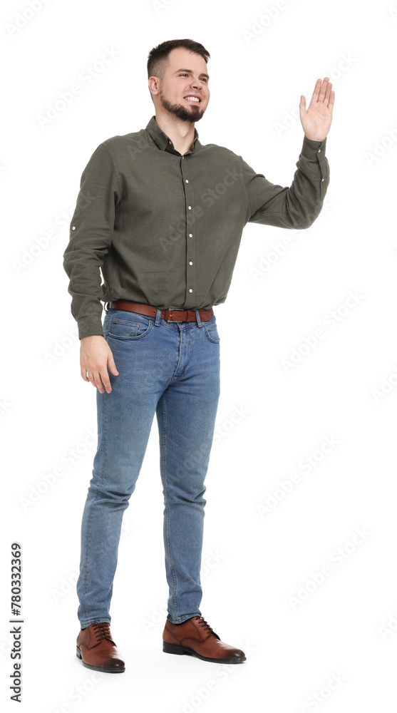 Man in shirt and jeans waving hand on white background Man in shirt and jeans waving hand on white background