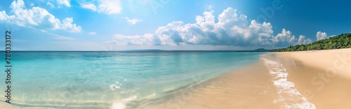 A beautiful sandy beach with clear blue water and bright sunlight, offering ideal conditions for summer holidays