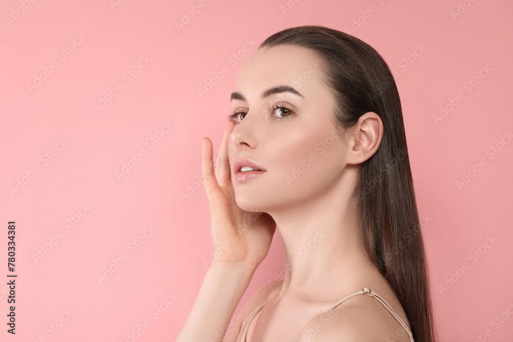 Portrait of beautiful young woman on pink background. Space for text Portrait of beautiful young woman on pink background. Space for text