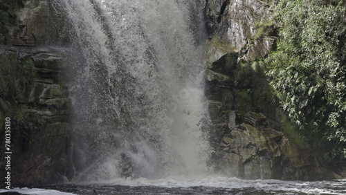 Slow Motion Waterfall Base with Splashing Torrent and Rocks