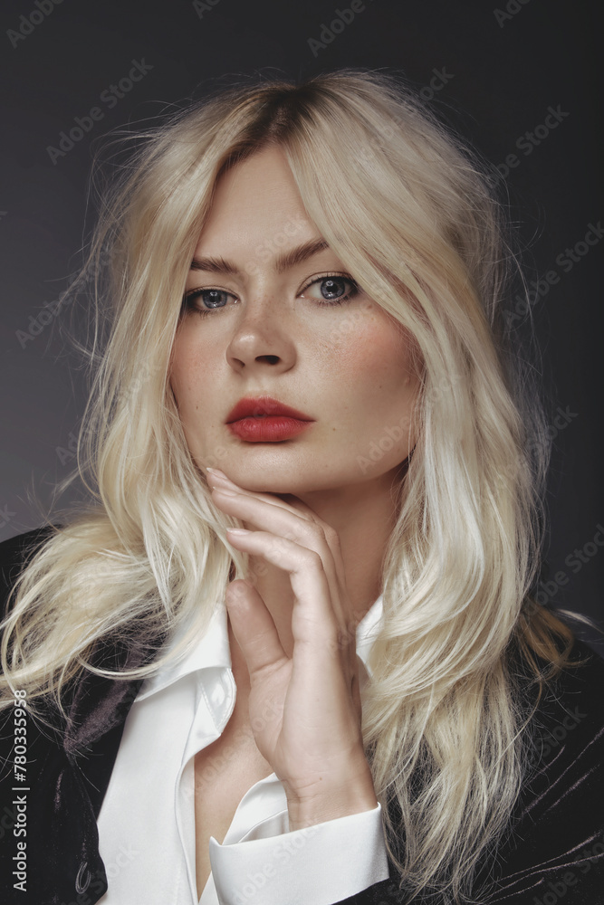 Blonde blue-eyed woman in white shirt with red lips Blonde blue-eyed woman in white shirt with red lips