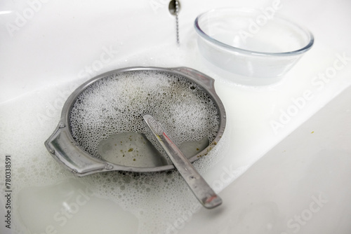 Washing dishes with soap