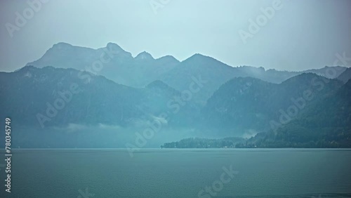 Foggy Attersee lake and Alps, time lapse view photo