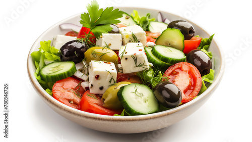 Greek salad with feta cheese, olives, and fresh vegetables in a bowl.