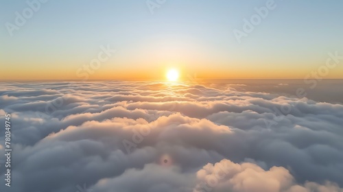 Amazing view of the sunrise above the clouds.