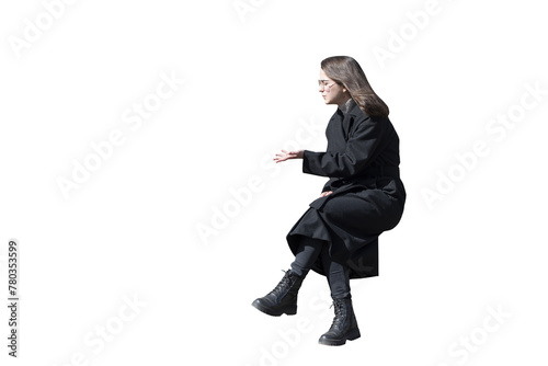 A woman in black coat in sitting pose isolated	